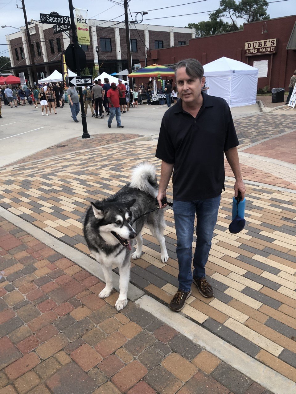 Jones Long and his dog Oscar, a husky, drew some attention at the Katy Rice Festival. Oscar was not the only dog at the festival, but he might have been the biggest.